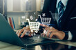 Online shopping concept.Businessman using laptop for online shopping, e-commerce, internet banking, spending money.