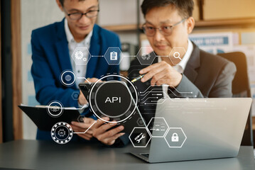 API Application Programming Interface, woman using laptop, tablet and smartphone with virtual screen API icon Software development tool, modern technology and networking concept..