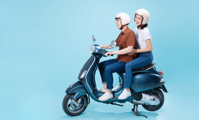 Wall Mural - Young Asian couple ride scooter on background