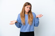 © luismolinero - Young blonde woman isolated on white background having doubts while raising hands
