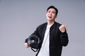 Wall Mural - Image of young Asian man with helmet on background