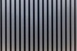 Slatted grey wooden wall panel. Modern ideas for decor and interior design, construction and renovation. Space for text. Front view.