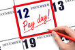 Hand writing text PAY DATE on calendar date December 12 and underline it. Payment due date