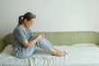 © evafesenuk - Mature unhappy woman sitting on sofa