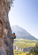 © zhukovvvlad - climber boy. the child trains in rock climbing.