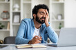 © Prostock-studio - Overworked tired indian male entrepreneur sitting at desk in home office