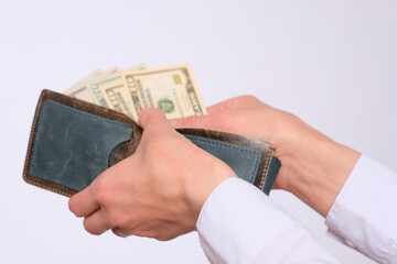 Wall Mural - Businesswoman holds a wallet with american dollars