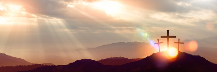 Silhouette of Jesus with Cross over calvary sunset,holy cross symbolizing the suffering,death and resurrection of Jesus Christ.concept for religion,worship,Good Friday,Easter,Jesus he is risen