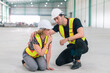 © kongga studio - Emergency help engineers provide first aid to construction workers in accidents. Safety team help a construction worker who has an accident.