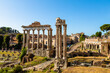 View of the ruins of the Roman Forum with the temple of Saturn and the temple of Vespasian and Titus. Rome, Italy