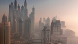 Fototapeta  - View of various skyscrapers in tallest recidential block in Dubai Marina aerial timelapse