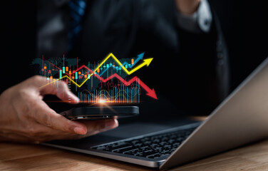 Wall Mural - Businessman management finance and investment concept, Capital gain world money economic growth. coin stack financial graph chart, market report on cash currency, Stock market instability concept.