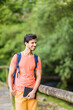 © Sangiao_Photography - south asian 40s male hiking with a backpack in Asturias green countryside with a diary in spain.