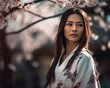 © drixe - Beautiful asian woman with long and straight hair wearing a colorful kimono, looking serious, standing in a background of cherry blossom trees. created with Generative AI
