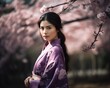 © drixe - Beautiful asian woman with long and straight hair wearing a colorful kimono, looking serious, standing in a background of cherry blossom trees. created with Generative AI