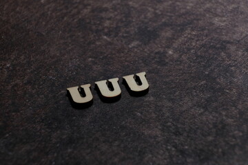 Wall Mural - the initials of the letter uuu. triple u.