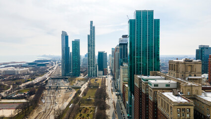 Wall Mural - aerial footage captures skyline of downtown Chicago from a bird's-eye view. The sprawling cityscape and towering skyscrapers are full of grandeur energy related to architecture, tourism and cityscapes