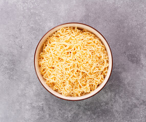 Canvas Print - Instant noodles or ramen food Thai Japanese Chinese tasty food in a white bowl on the table-top view