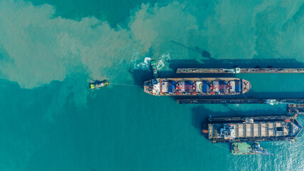 Tug boat Draging cargo container ship to dry dock concept maintenance service working in the sea. Insurance and Maintenance Cargo Ship concept. Freight Service maintenance Insurance