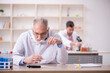 © Elnur - Two male chemists working at the lab