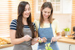 © Wongsakorn - happy and smile lesbian couple cooking salad in the kitchen. salad in glass bowl with sweet smile while cooking together. pride month to promote equality and differences of homosexual.