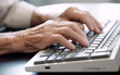© Malchevska Studio - Senior older hands using keyboard. Generative AI