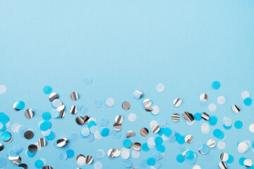 Boy, baby birthday, celebration concept with blue confetti