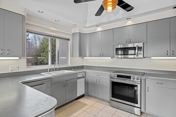 Canvas Print - Comfortable and modern kitchen in grey colors