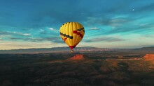 Hot Air Balloon In The Middle Of Arizona Desert, Sedona, United States - drone shot