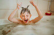 © Westend61 - Playful boy with spiked hair screaming in bathtub