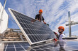 © Westend61 - Engineers together installing solar panels