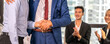 © Art_Photo - Image two business partner meeting successful handshake together with success join congratulation good deal contract in modern office.Partnership approval and teamwork concept