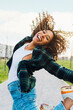 © Westend61 - Cheerful young woman jumping and having fun