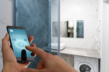 Hand holding smart phone with home control application with water detected, Smart home concept.