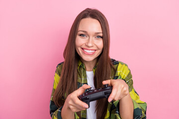 Poster - Portrait of optimistic good mood girl with straight hairdo dressed plaid shirt play excited video game isolated on pink color background