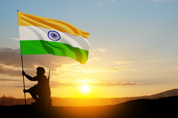 Silhouette of soldier on a background of India flag and the sunset or the sunrise.