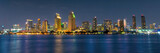 Fototapeta Miasta - Panorama of San Diego skyline at night with water colorful reflections, view from Coronado island, California