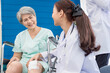 © SKW - A doctor is caring for an elderly female patient at a hospital where she has undergone knee surgery. This made her need to use a wheelchair instead of walking and have a doctor take care of it closely