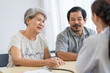 © SKW - Asian seniors who are healthy, in a good mood, smiling, talking with financial or life insurance staff to take care of life after retirement.