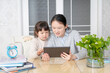 © onlyyouqj - Mom and daughter learn online classes together