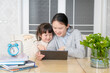 © onlyyouqj - Mom and daughter learn online classes together