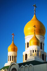 Wall Mural - The yellow onion domes are a distinctive architecture feature of the Russian Orthodox church, here Holy Virgin Cathedral in San Francisco, 