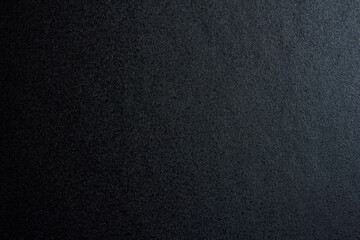 Black paper texture or background. Blank paper surface for you designs.