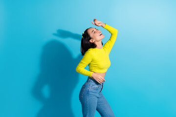 Sticker - Photo of youngster charming relaxed girl dancing have fun listen pop music wear stylish outfit take rhythm harmony isolated on blue color background