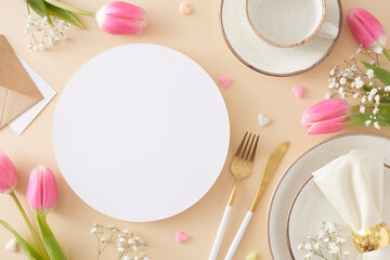 Wall Mural - Mother's Day celebration concept. Top view photo of white circle cutlery knife fork plate fabric napkin cup and saucer colorful hearts and pink tulips on pastel beige background with blank space