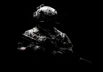 Modern army special forces equipped soldier, anti terrorist squad fighter, elite mercenary in helmet, studio portrait in darkness. Close up, half length