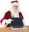 © vectorfusionart - Happy Santa showing laptop screen