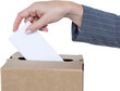 Close-up of businesswoman putting ballot in vote box