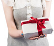 © vectorfusionart - Woman offering a wrapped gift