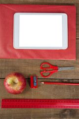 Poster - Overhead view of school supplies with digital tablet and apple